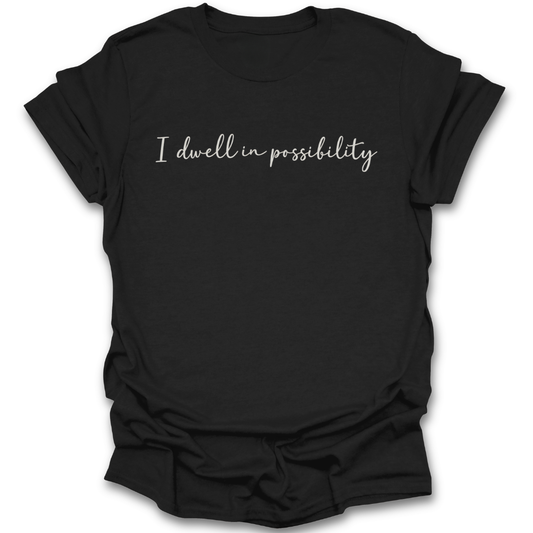 Black t-shirt with 'I dwell in possibility' text on a white background Emily Dickinson shirt, I dwell in possibility shirt, poetry lover shirt, bookish shirt, literary quote shirt, poet shirt, classic literature shirt, librarian gift, English teacher gift, dark academia shirt, book lover gift.