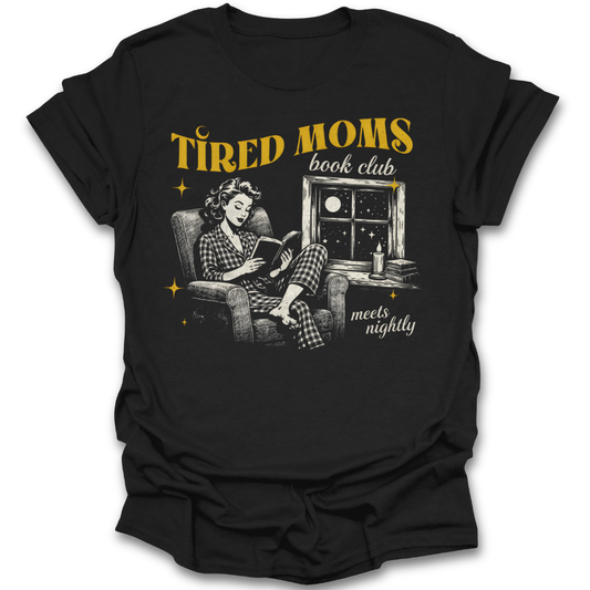 Black t-shirt with graphic of a woman reading a book and text 'Tired Moms book club meets nightly' on a white background. funny book reading literary t shirt