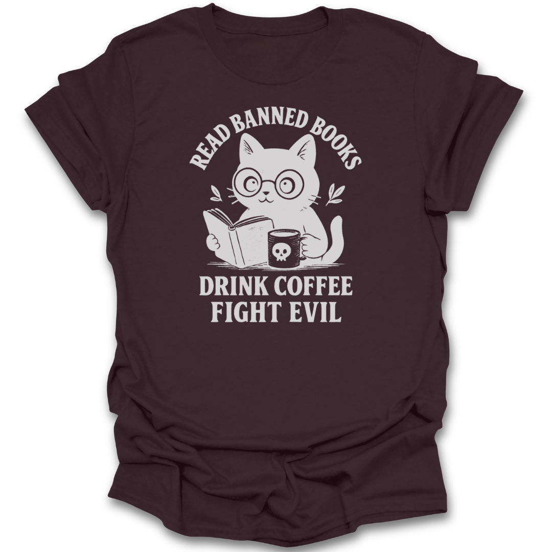 Brown t-shirt with a graphic of a cat reading a book and text 'Read banned books, drink coffee, fight evil' on a white background. funny book reading literary t shirt