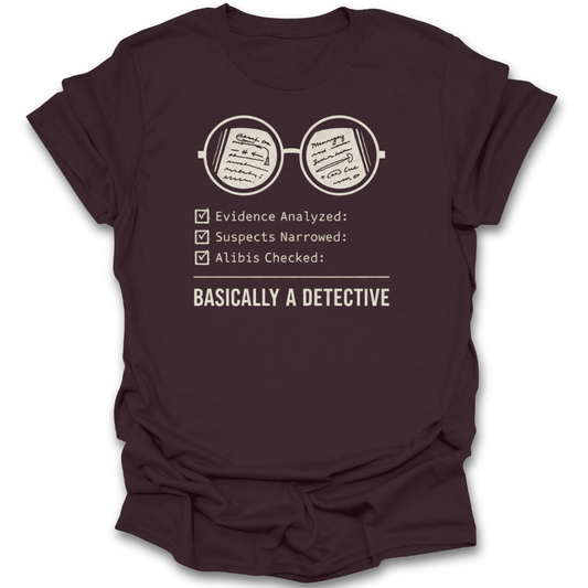 Brown t-shirt with a graphic and text about being a detective on a white background mystery book shirt, detective book lover shirt, book lover shirt, mystery reader gift, cozy mystery shirt, thriller reader shirt, Sherlock Holmes gift, bookworm apparel, reader gift, bibliophile shirt.