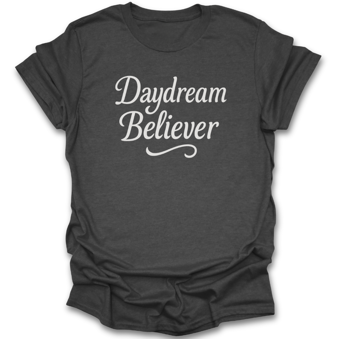 Dark gray t-shirt with 'Daydream Believer' text on a white background