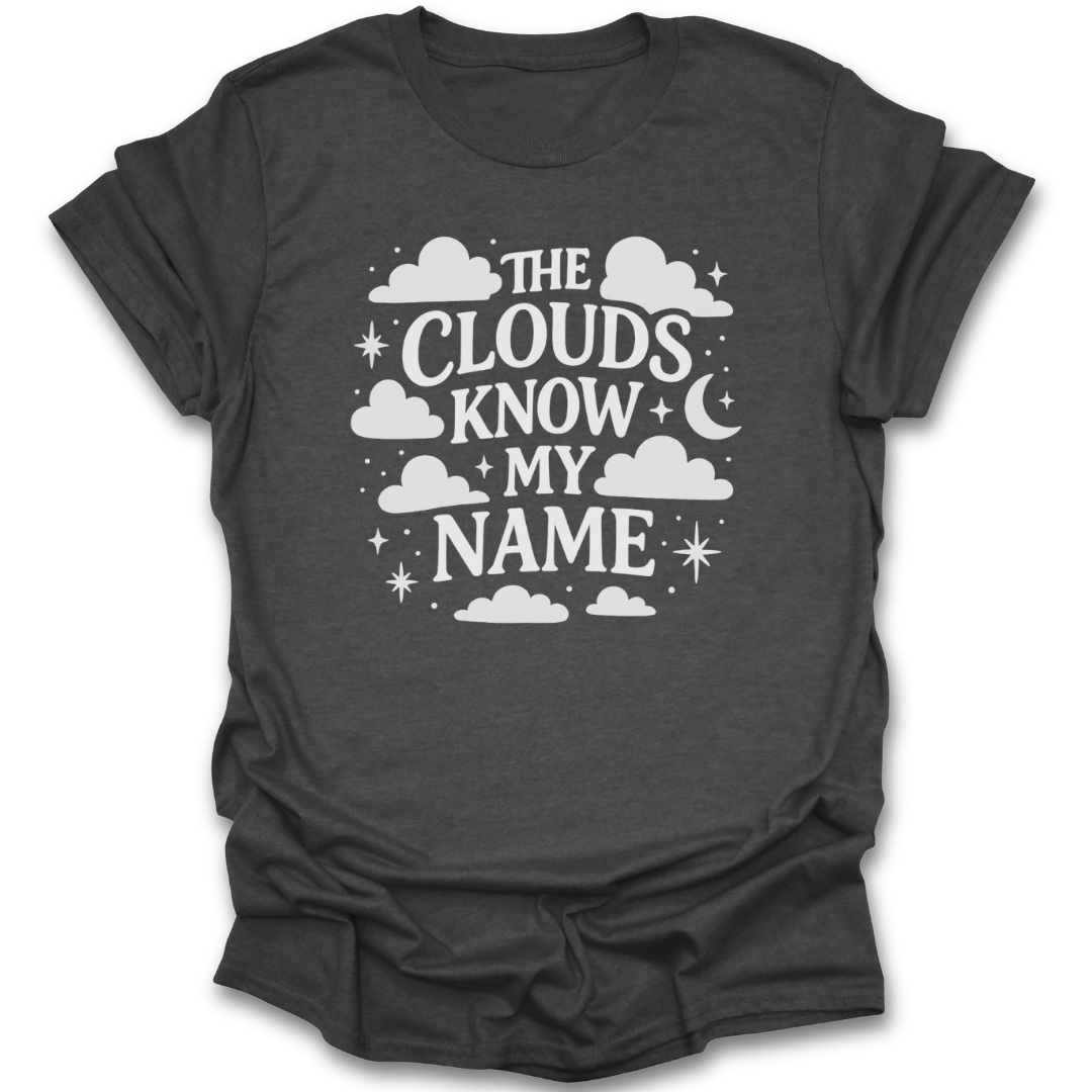 Dark gray t-shirt with white text 'The Clouds Know My Name' on a white background