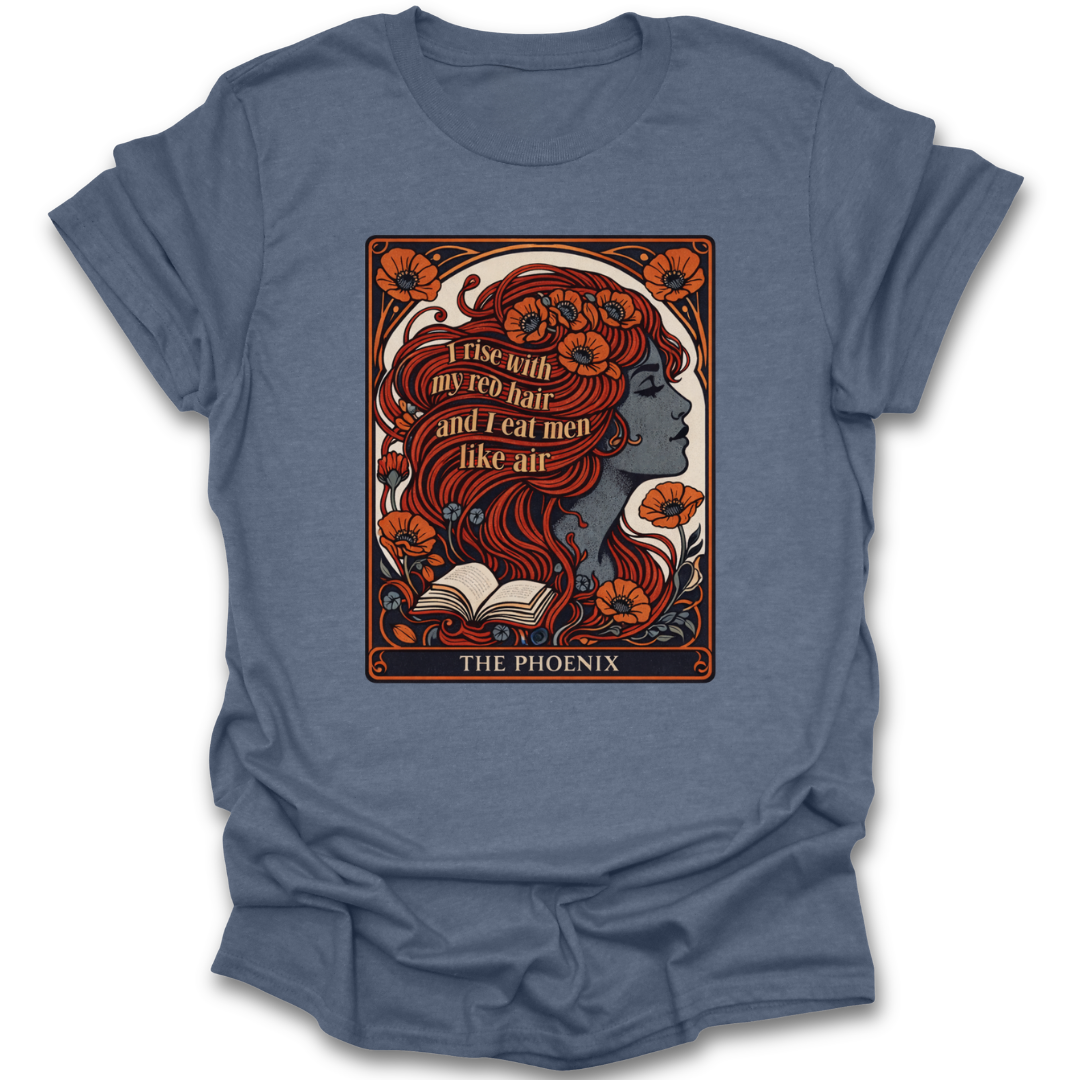 Blue t-shirt with a graphic design of a woman with red hair and text on a white background sylvia plath poetry book reading literary t shirt