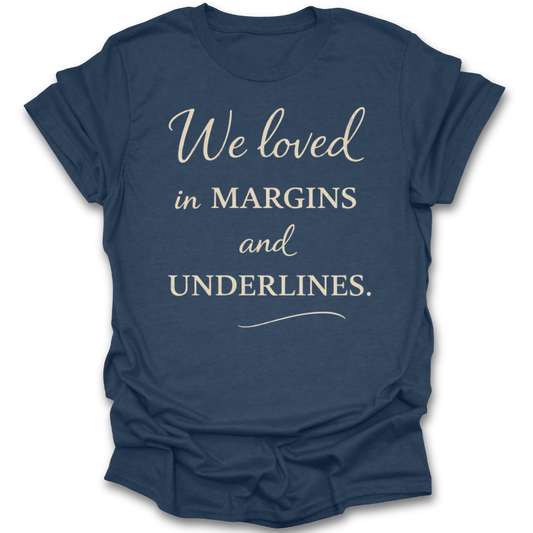 Blue t-shirt with white text 'We loved in MARGINS and UNDERLINES' on a white background romance book reading literary t shirt