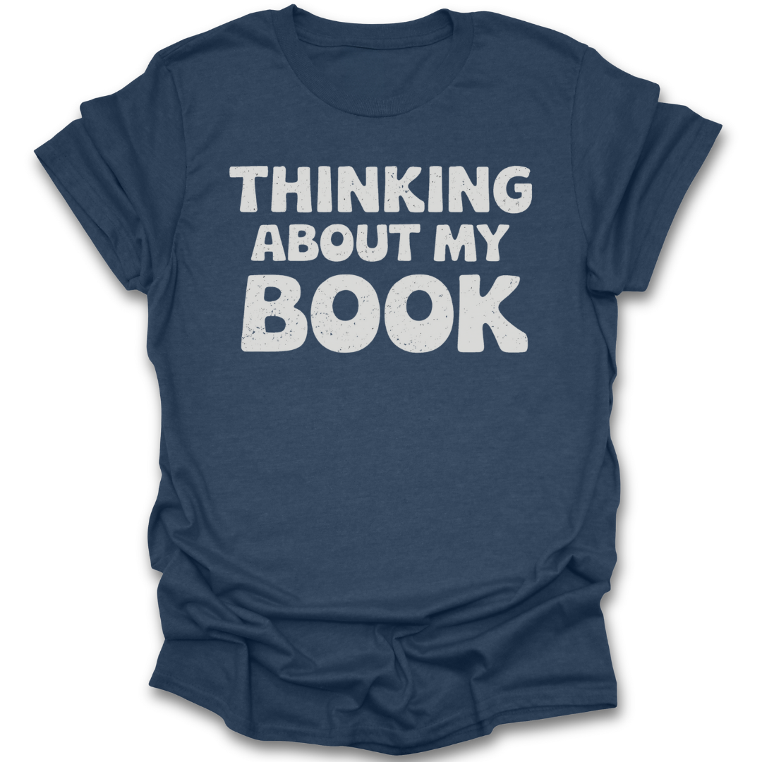 Blue t-shirt with 'THINKING ABOUT MY BOOK' text on a white background funny book reading literary t shirt