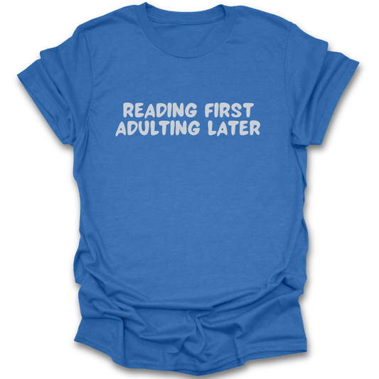 Blue t-shirt with 'Reading First, Adulting Later' text on a white background funny book reading literary t shirt