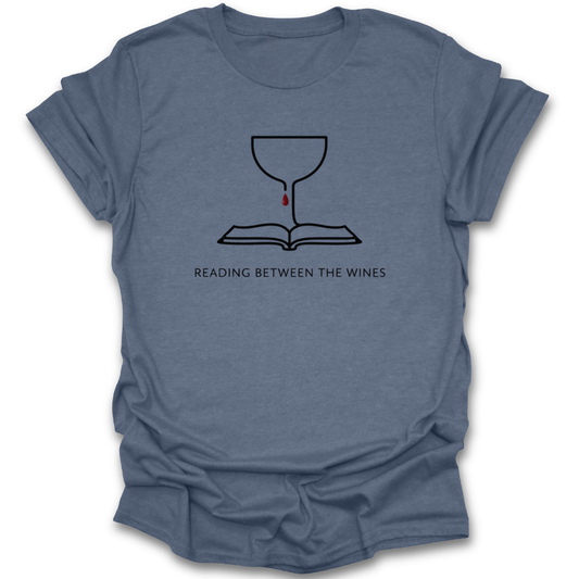 Blue t-shirt with a graphic design and text 'Reading Between the Wines' on a white background book lover shirt, reading shirt, wine lover shirt, funny book shirt, book club shirt, bibliophile gift, reader gift, bookworm shirt, literary shirt, wine and books shirt, funny reader tee, bookish apparel, bookstore shirt, librarian gift