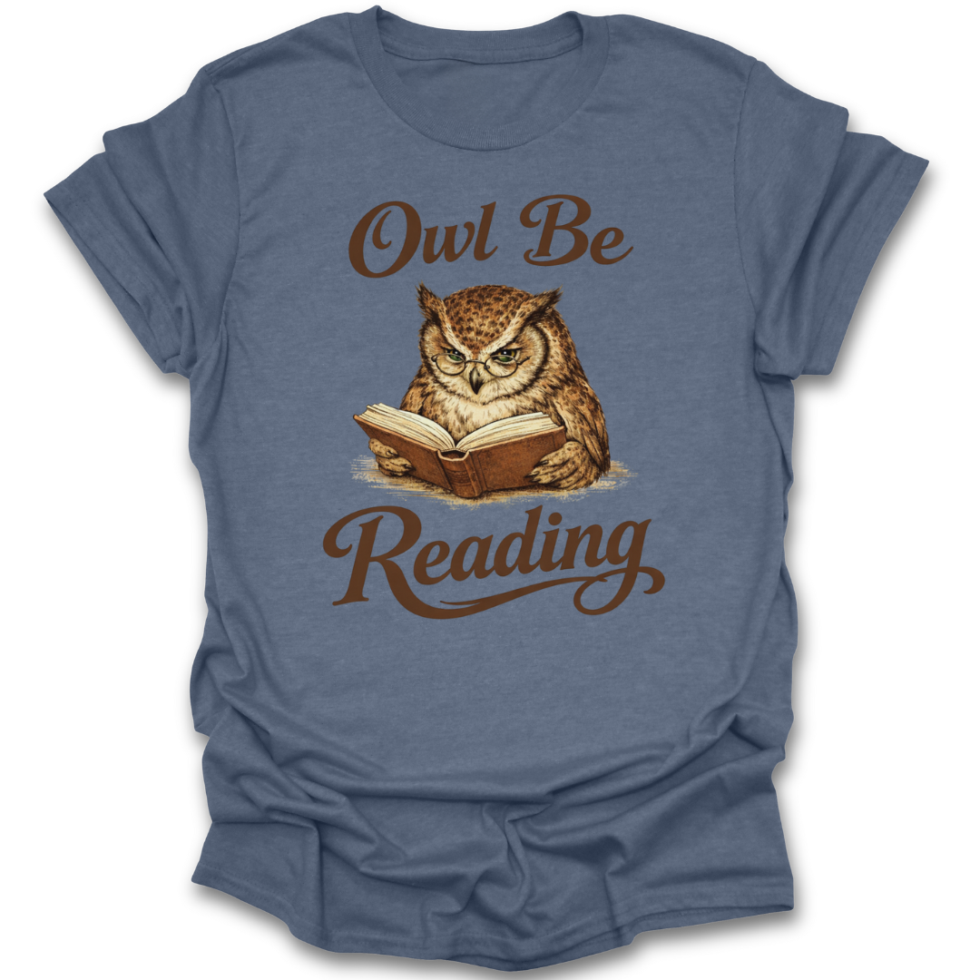 Blue t-shirt with an owl reading a book graphic and 'Owl Be Reading' text on a white background