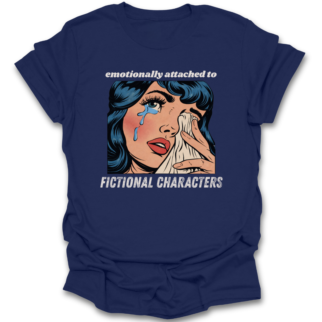 Navy blue t-shirt with graphic of a crying woman and text 'emotionally attached to fictional characters' on a white background.