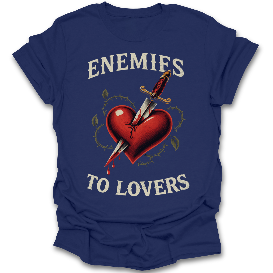 Blue t-shirt with a graphic of a heart being stabbed by a sword and text 'ENEMIES TO LOVERS' on a white background. dark romance t shirt tee