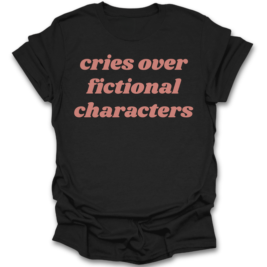 Black t-shirt with red text 'cries over fictional characters' on a white background romance funny book reading literary t shirt