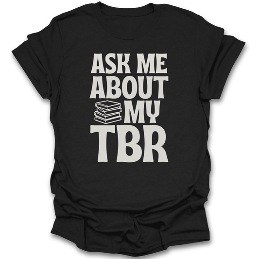 Black t-shirt with 'Ask Me About My TBR' text and book emoji on a white background funny book reading literary t shirt