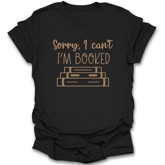 Black t-shirt with gold text 'Sorry, I can't I'm booked' and book illustrations on a white background funny book reading literary t shirt