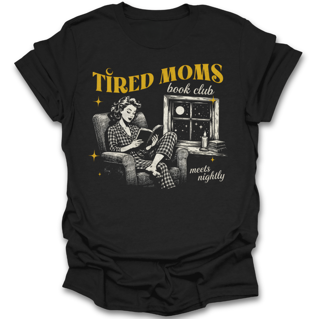 Black t-shirt with graphic of a woman reading a book and text 'Tired Moms book club meets nightly' on a white background. funny book reading literary t shirt