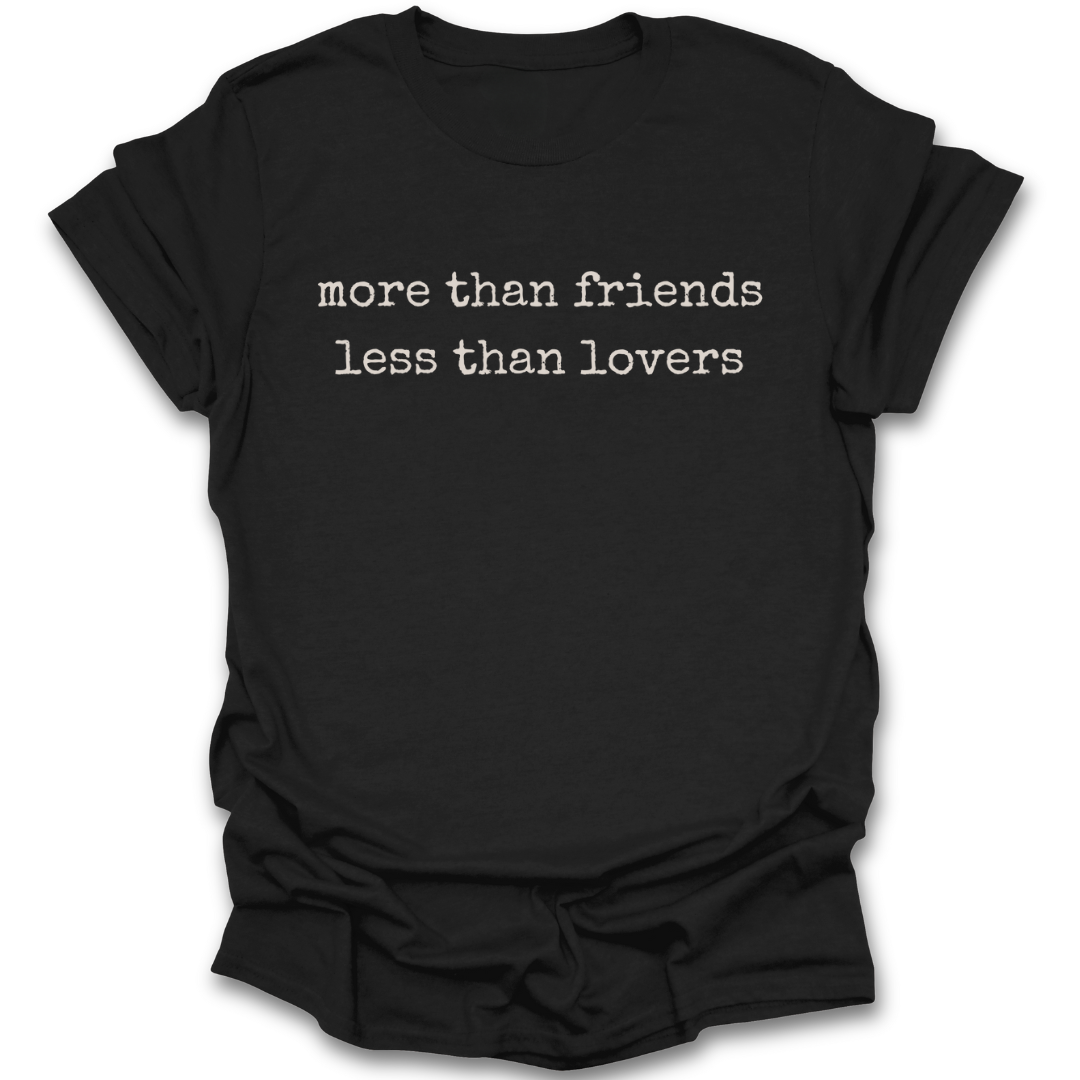 Black t-shirt with white text 'more than friends less than lovers' on a white background romance  funny book reading literary t shirt