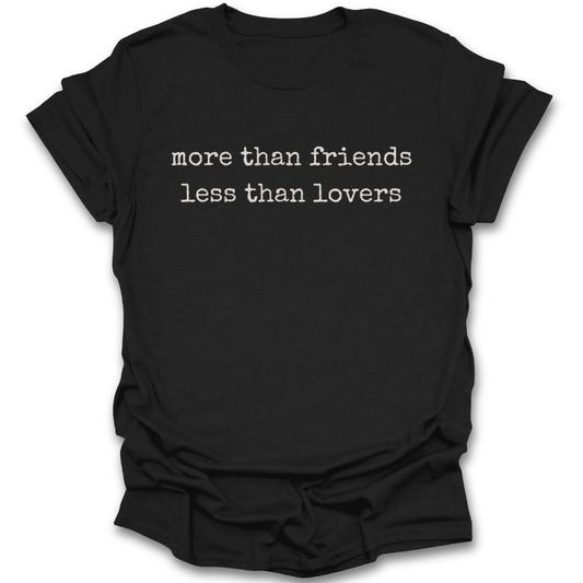 Black t-shirt with white text 'more than friends less than lovers' on a white background romance  funny book reading literary t shirt