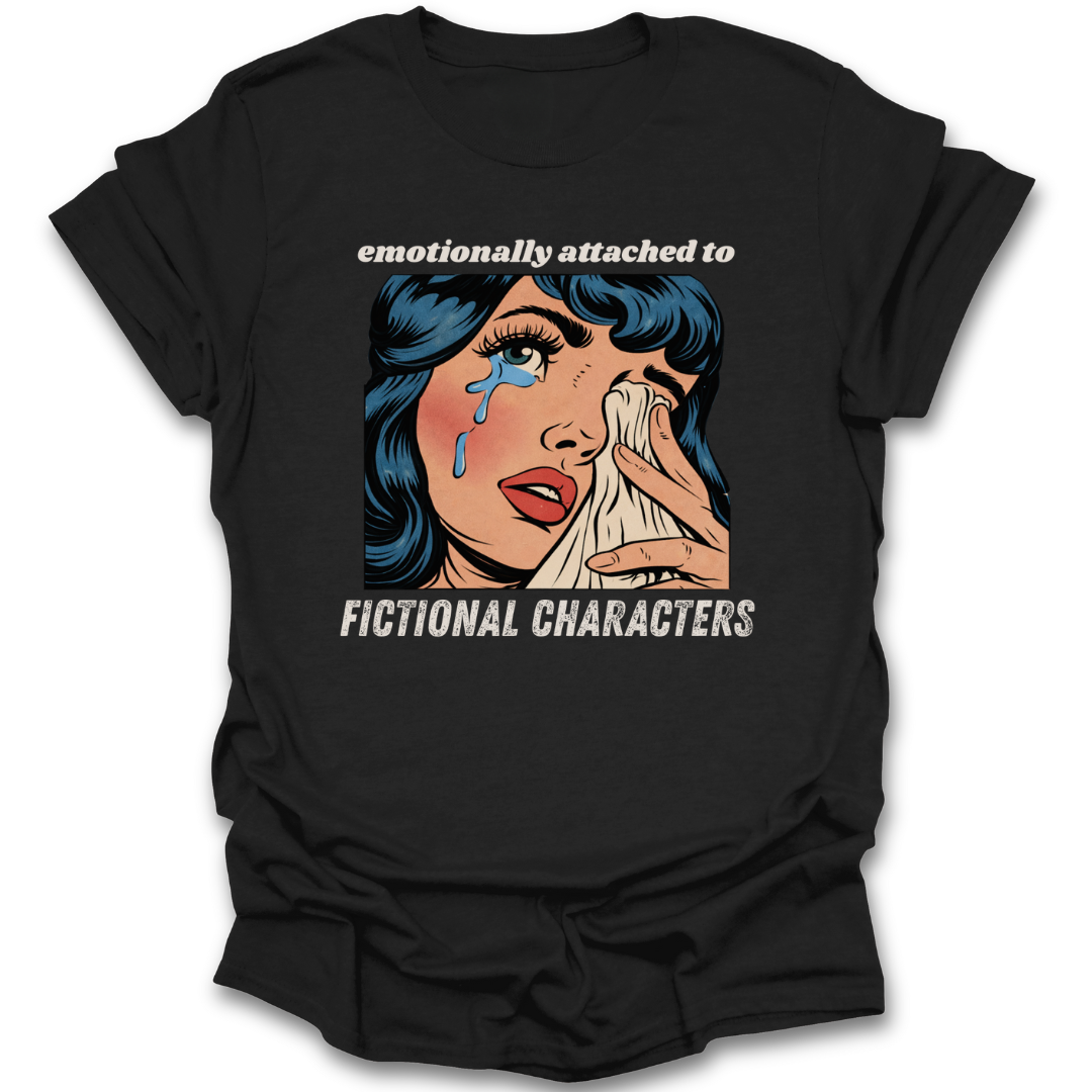 Black t-shirt with a graphic of a woman crying and text 'emotionally attached to fictional characters' on a white background.