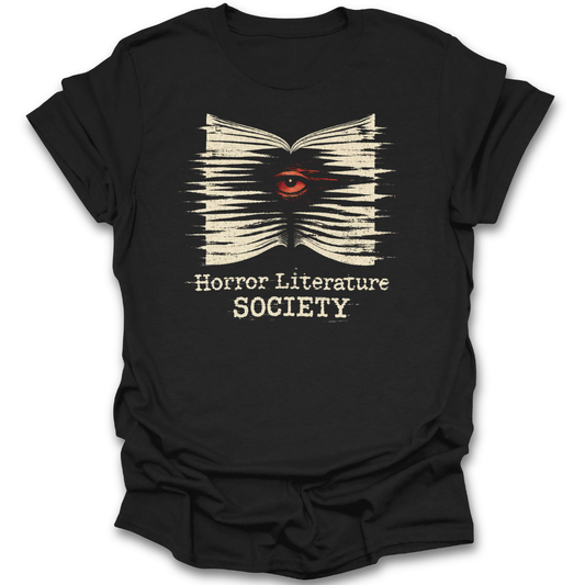 Black t-shirt with a graphic design of an open book with an eye and text 'Horror Literature Society' on a white background. horror literature shirt, horror book shirt, book lover shirt, horror reader gift, gothic book shirt, dark academia shirt, spooky bookish shirt, literature society tee, horror books apparel, bookworm shirt.&nbsp;