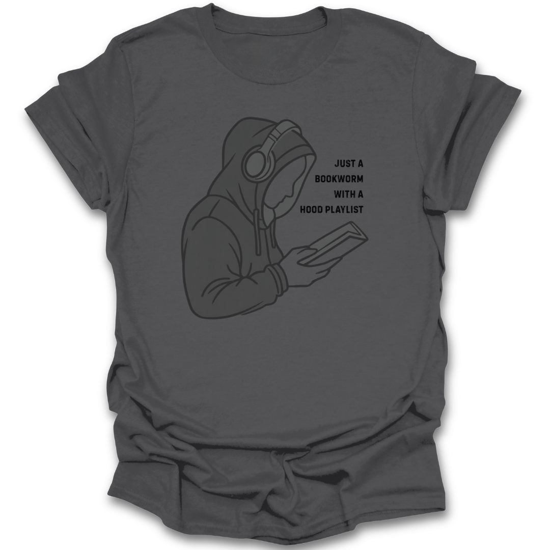 Gray t-shirt with a graphic of a person wearing headphones and holding a book, with text 'Just a bookworm with a hood playlist'. funny book reading literary t shirt