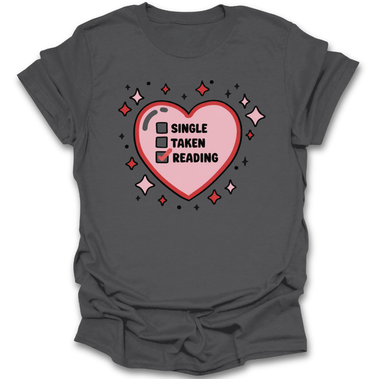 Gray t-shirt with a pink heart graphic and text on a white background romance funny book reading literary t shirt
