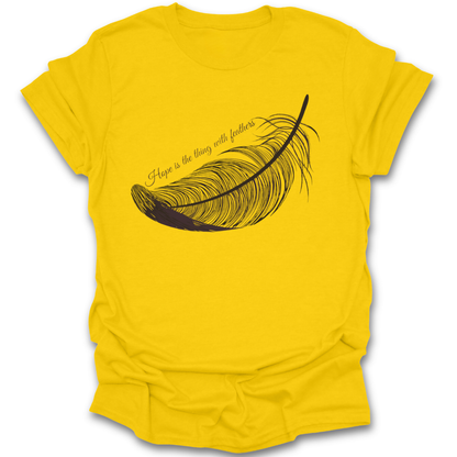 Yellow t-shirt with a black feather graphic and text on a white background Emily Dickinson shirt, hope is the thing with feathers shirt, poetry lover shirt, literary quote shirt, bookish shirt, poet shirt, English teacher gift, librarian gift, dark academia shirt, book lover gift.