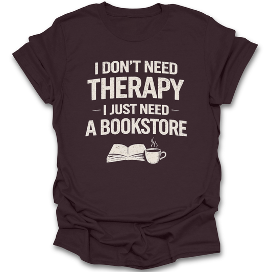 Brown t-shirt with text 'I don't need therapy, I just need a bookstore' on a white background mental health funny book reading literary t shirt