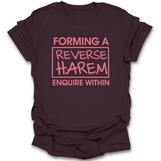 Brown t-shirt with pink text 'FORMING A REVERSE HAREM ENQUIRE WITHIN' on a white background. reverse harem shirt, romance reader shirt, book lover t-shirt, spicy book shirt, romantasy shirt, funny bookish tee, booktok romance shirt, reader merch, romance book lover gift, book club shirt