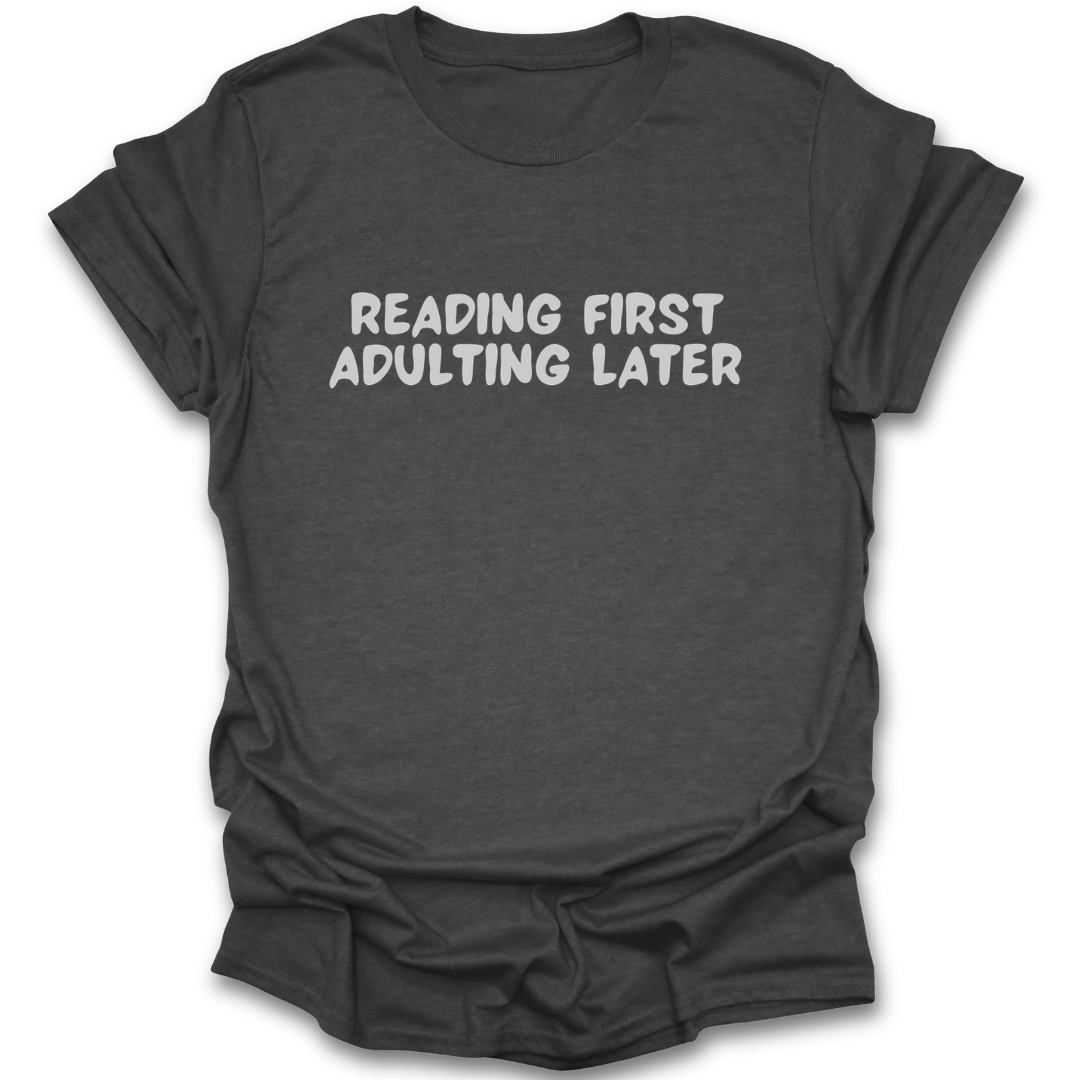 Dark gray t-shirt with 'Reading First, Adulting Later' text on a white background funny book reading literary t shirt