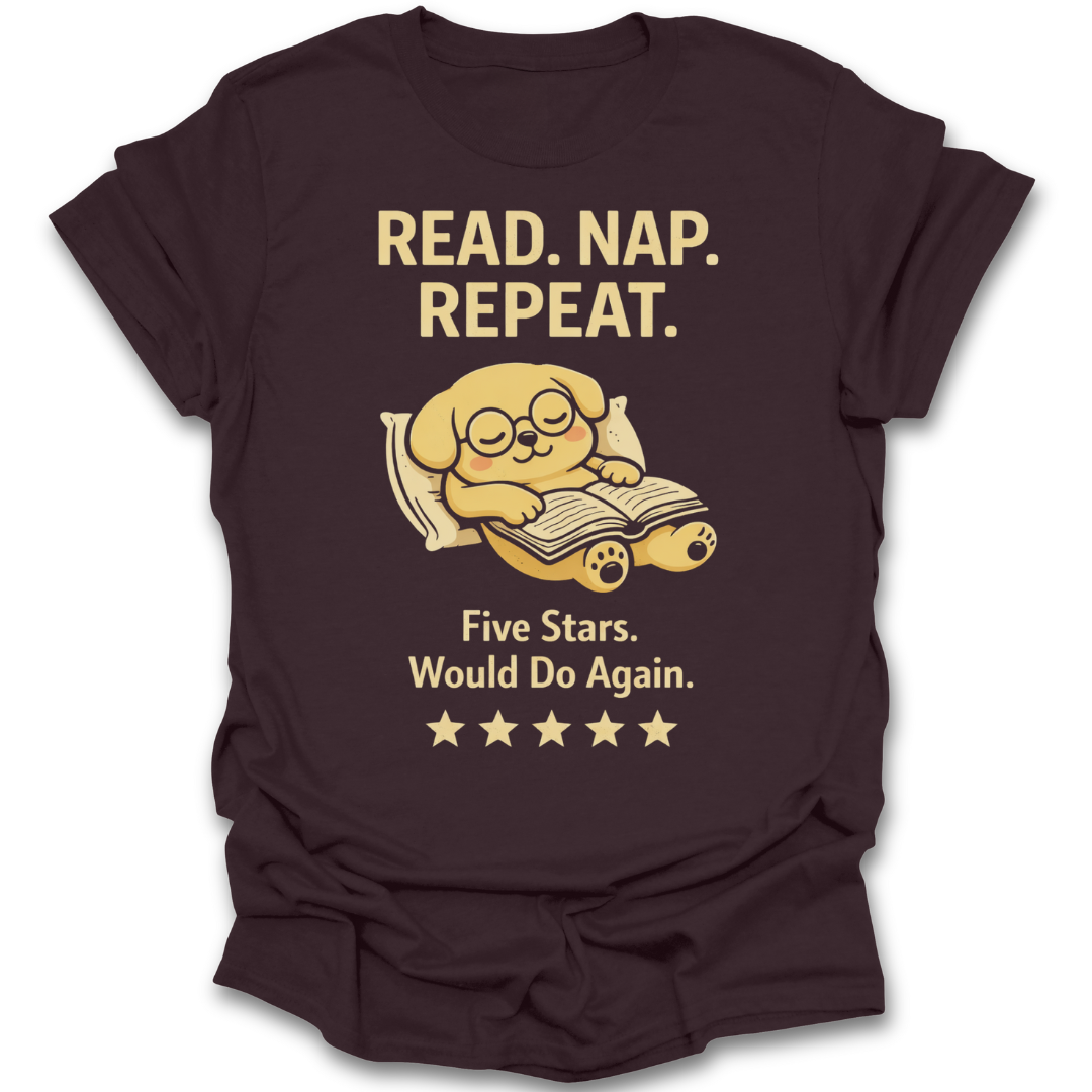 Brown t-shirt with a graphic of a dog reading a book and text 'Read. Nap. Repeat.' on a white background. funny book reading literary t shirt