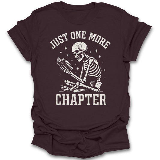 Brown t-shirt with skeleton design and 'Just One More Chapter' text on a white background funny book reading t shirt