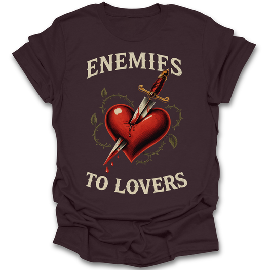 Brown t-shirt with a graphic of a heart being stabbed by a sword and text 'ENEMIES TO LOVERS' on a white background. dark romance tee t shirt
