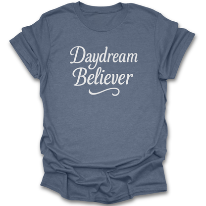 Blue t-shirt with 'Daydream Believer' text on a white background