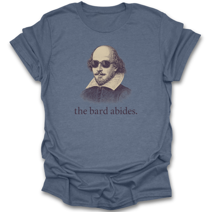 Blue t-shirt with a graphic of Shakespeare wearing sunglasses and the text 'the bard abides' on a white background. funny book reading literary t shirt