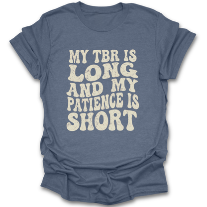 Blue t-shirt with white text 'My TBR is long and my patience is short' on a white background funny book reading literary t shirt