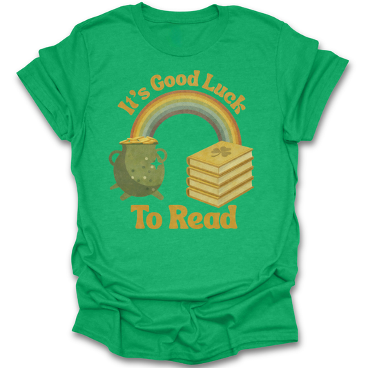 Green t-shirt with a rainbow, pot of gold, and books graphic and 'It's Good Luck To Read' text. st patricks day funny book reading literary t shirt