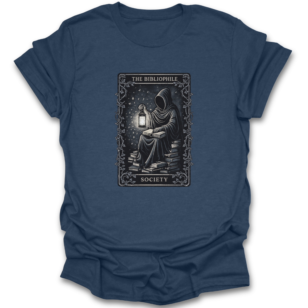 Blue t-shirt with a graphic design of a person holding a lantern and books, labeled 'The Bibliophile Society'. book reading literary t shirt