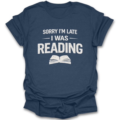 Navy blue t-shirt with white text 'Sorry I'm late I was reading' on a white background funny book reading literary t shirt
