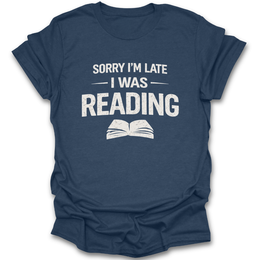 Navy blue t-shirt with white text 'Sorry I'm late I was reading' on a white background funny book reading literary t shirt