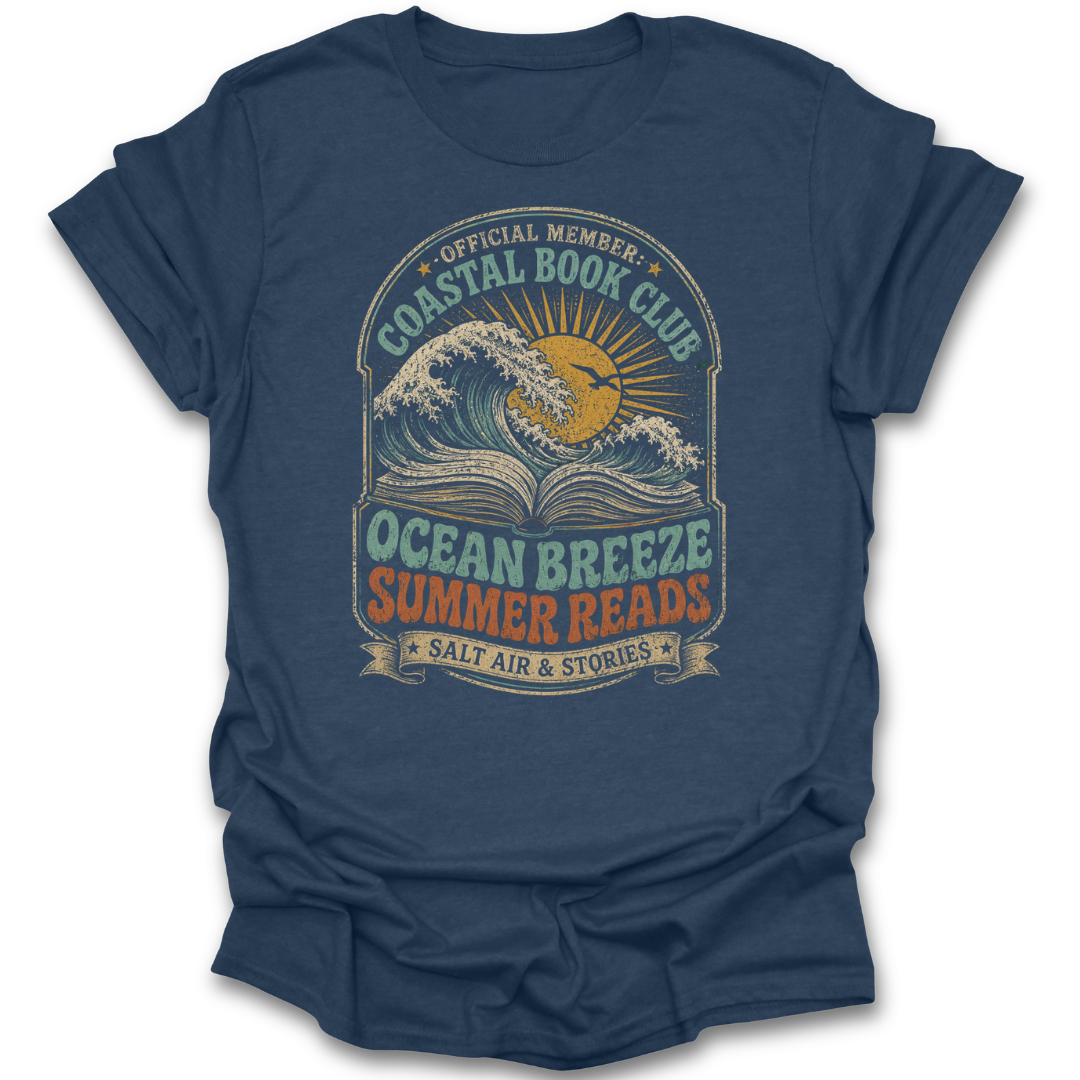 Blue t-shirt with 'Coastal Book Club' graphic design featuring waves and sun.