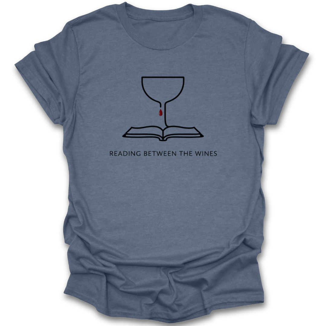 Blue t-shirt with a graphic design and text 'Reading Between the Wines' on a white background book lover shirt, reading shirt, wine lover shirt, funny book shirt, book club shirt, bibliophile gift, reader gift, bookworm shirt, literary shirt, wine and books shirt, funny reader tee, bookish apparel, bookstore shirt, librarian gift
