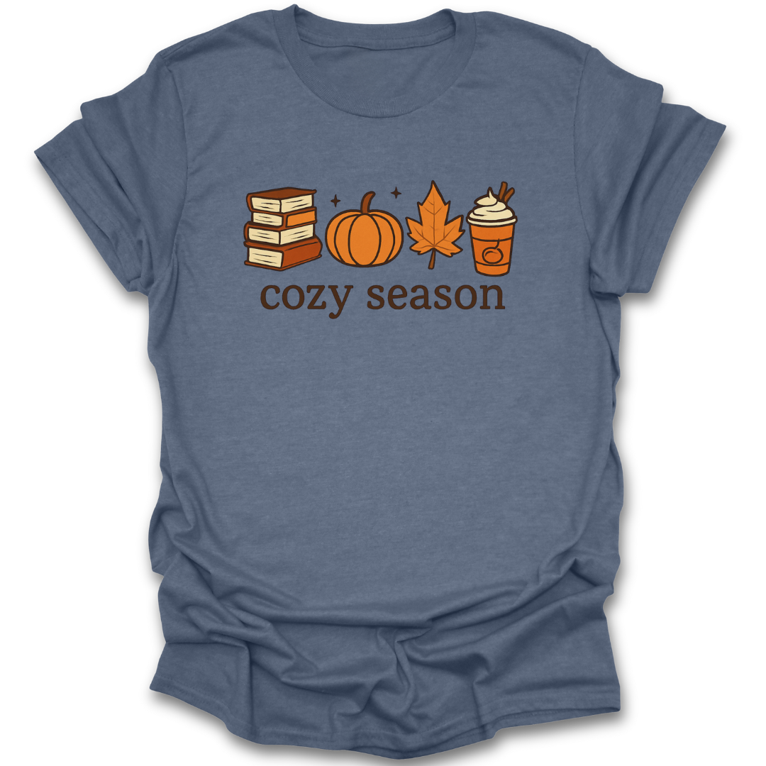Blue t-shirt with autumn-themed graphics and 'cozy season' text on a white background book reading tee t shirt literary