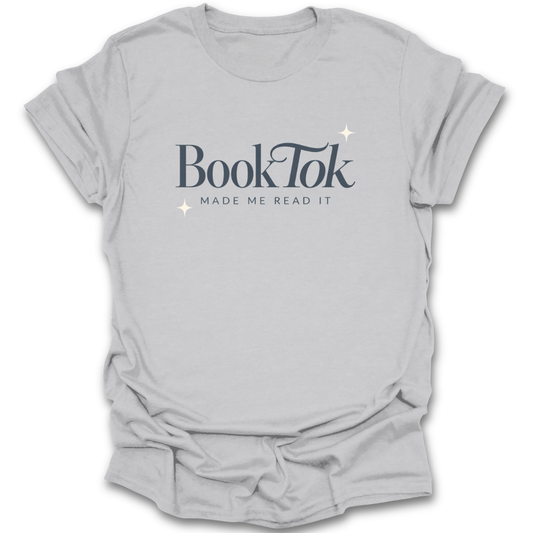 Gray t-shirt with 'BookTok Made Me Read It' text on a white background funny book reading literary t shirt