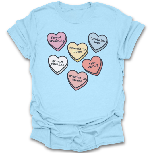 Light blue t-shirt with colorful heart-shaped text design on a white background romance funny book reading literary t shirt