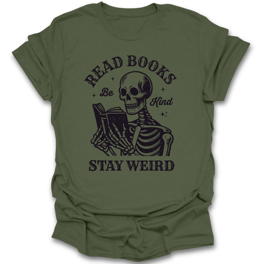 Green t-shirt with a skeleton reading a book graphic and text 'Read Books Be Kind Stay Weird' on a white background. funny book reading literary t shirt