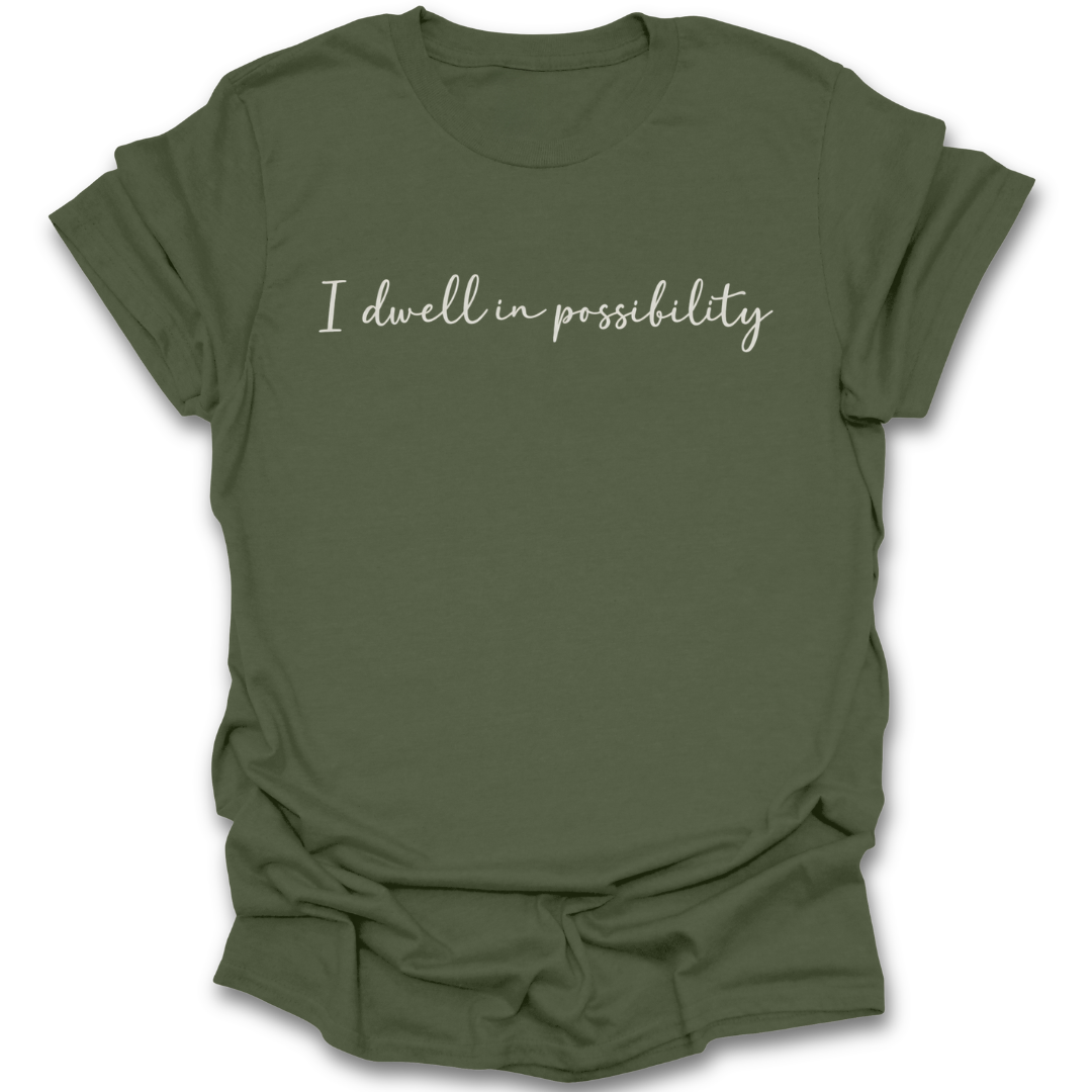 Green t-shirt with 'I dwell in possibility' text on a white background Emily Dickinson shirt, I dwell in possibility shirt, poetry lover shirt, bookish shirt, literary quote shirt, poet shirt, classic literature shirt, librarian gift, English teacher gift, dark academia shirt, book lover gift.