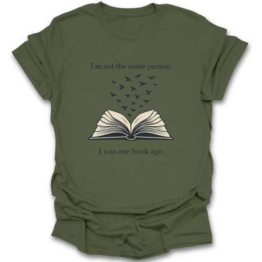 Green t-shirt with an open book graphic and text on a white background book reading literary t shirt