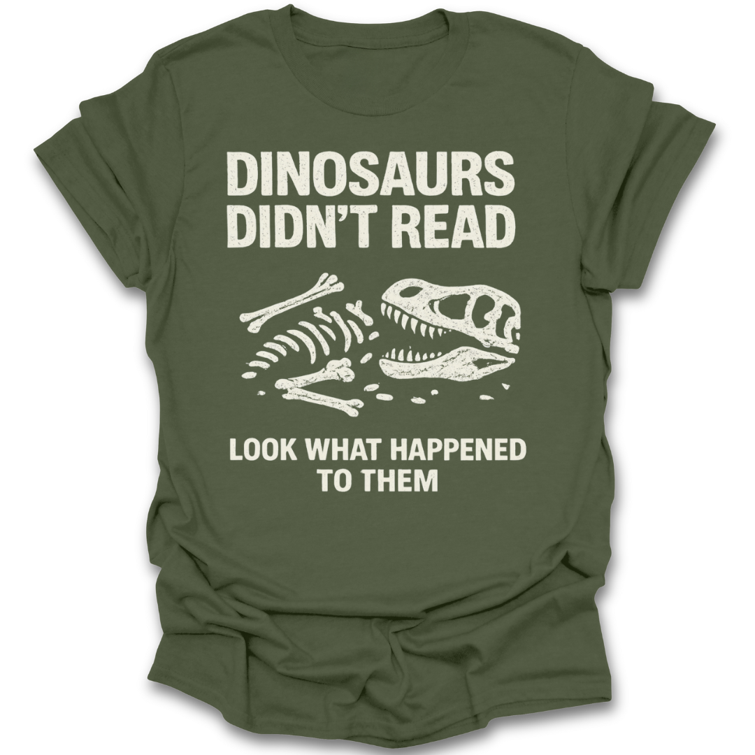 Green t-shirt with dinosaur skeleton graphic and text on a white background reading book t shirt
