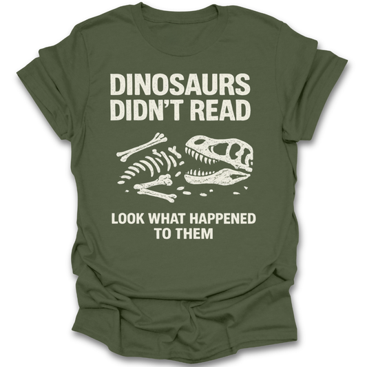 Green t-shirt with dinosaur skeleton graphic and text on a white background reading book t shirt
