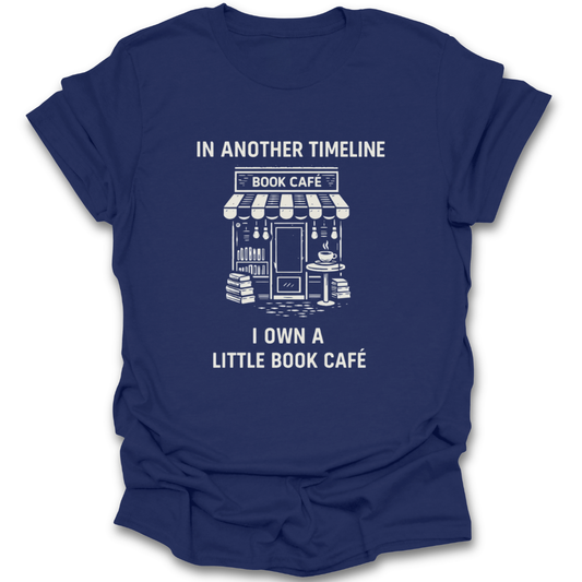 Blue t-shirt with white text and graphic of a book café on a white background funny book reading literary t shirt