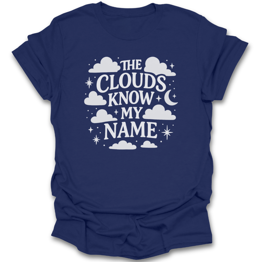 Navy blue t-shirt with white clouds know my name design and text on a white background